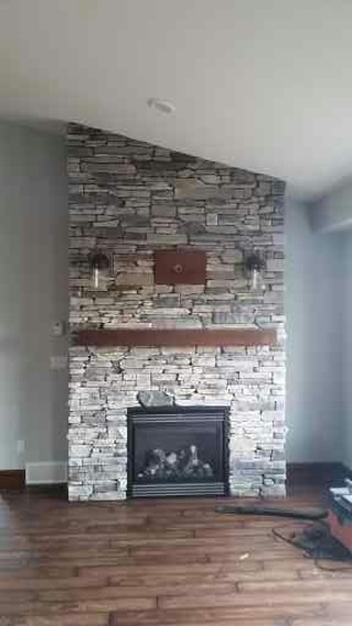 floor to ceiling fireplace with slope ceiling