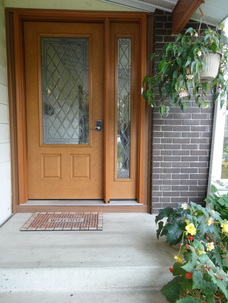 front entry door with 3/4 diamond glass pane and single side window